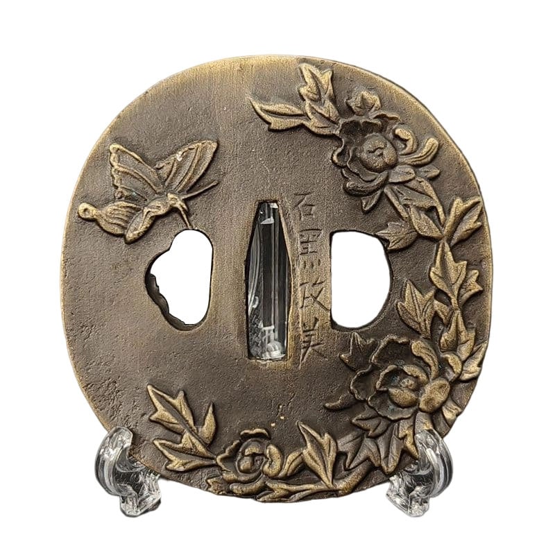 Tsuba with Peony and Butterfly Design, Alloy, Modern Piece: Tsuba with Peony and Butterfly Design, Alloy, Modern Piece Material: Alloy. Weight: Approximately 116 grams. Thickness: Approximately 5 millimeters. The item is only the tsuba; the sword stand is for 