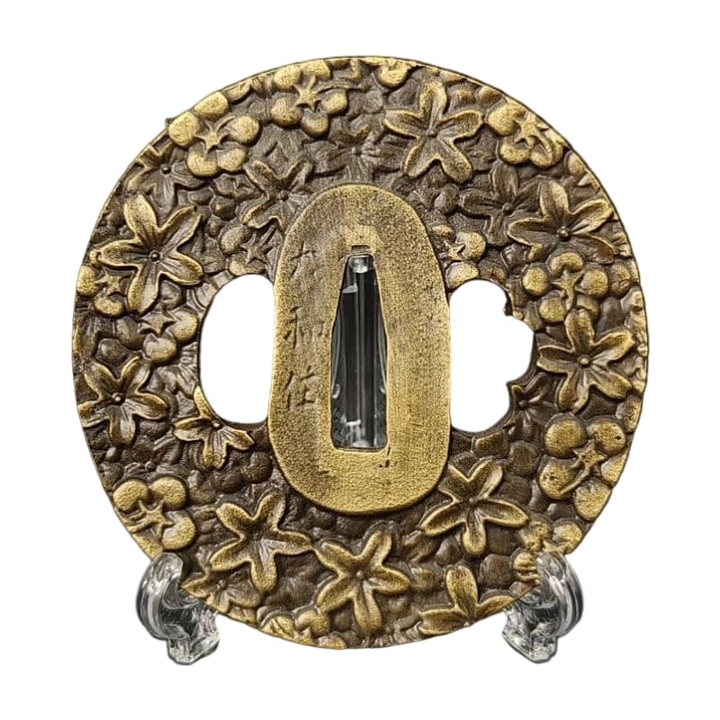 Tsuba with Cherry Blossom Design, Alloy, Modern Piece: Tsuba with Cherry Blossom Design, Alloy, Modern Piece Material: Alloy, Weight: Approximately 125 grams, Thickness: Approximately 5 millimeters. The item is solely the tsuba; the sword stand is used fo