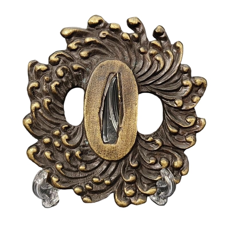 Tsuba with Chrysanthemum Design, Alloy, Modern Piece: Tsuba with Chrysanthemum Design, Alloy, Modern Piece Material: Alloy. Weight: Approximately 133 grams. Thickness: Approximately 7 millimeters. The item is only the tsuba; the sword stand is for photog