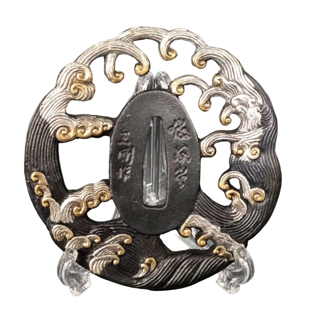 Tsuba with Design of Sea Waves, Bronze Base, Gilded with Gold and Silver, Openwork Carving: Tsuba with Design of Sea Waves, Bronze Base, Gilded in Gold and Silver, Openwork Carving Material: Made of bronze, approximately 5mm thick, weighing approximately 115 grams. The item is only the tsuba