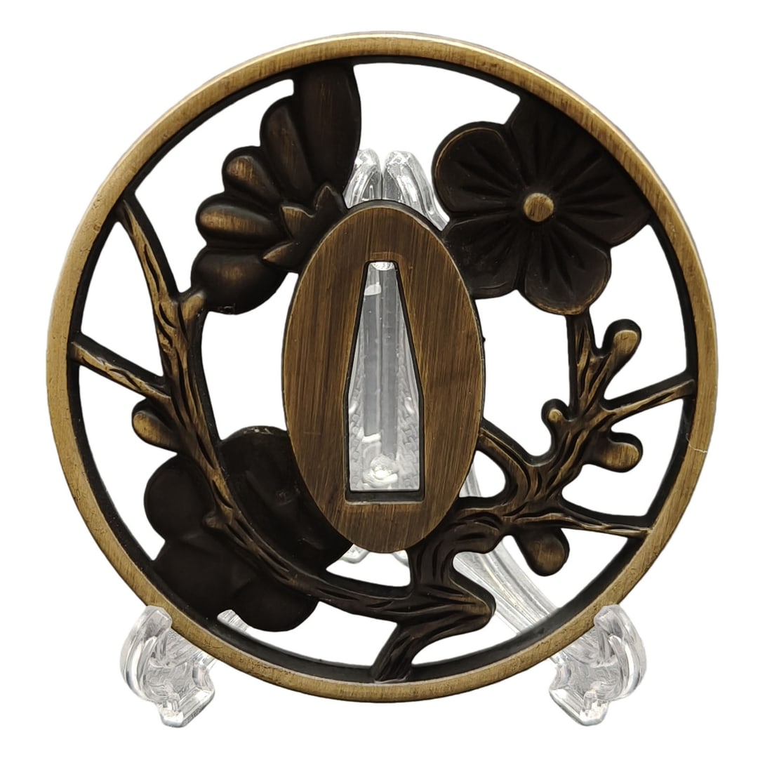 Tsuba with Cherry Blossom Design, Alloy, Craftsmanship: Tsuba with Cherry Blossom Design, Alloy Material: Alloy. Thickness: Approximately 5 millimeters. Weight: Approximately 82 grams. The item is solely the tsuba and does not include a tsuba stand. The it