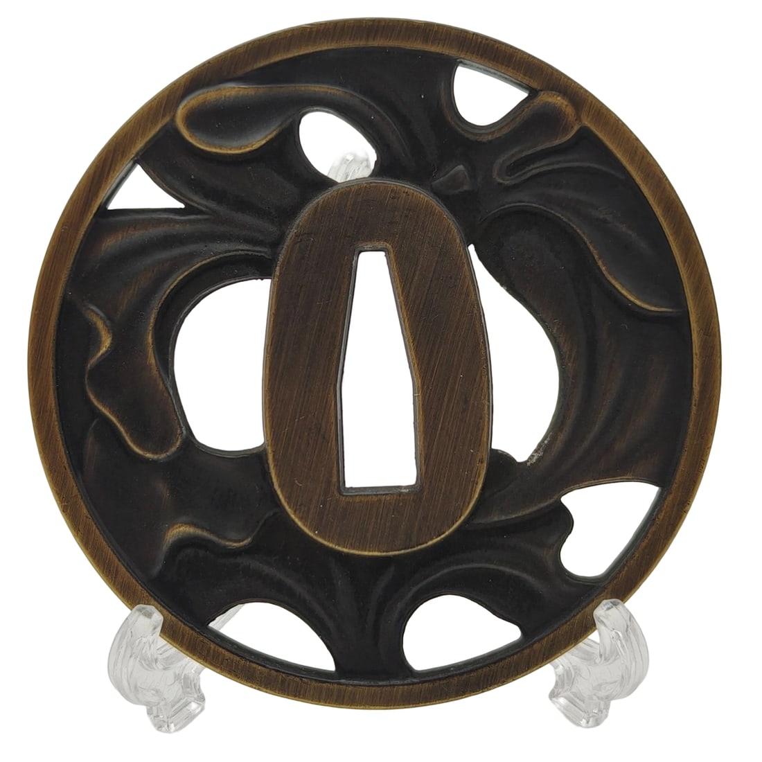 Tsuba with Lily Design, Alloy, Craftsmanship: Tsuba with Lily Design, Alloy Material: Alloy. Thickness: Approximately 5mm. Weight: Approximately 113g. The item is the tsuba only, and does not include a tsuba stand. The item is handcrafted.