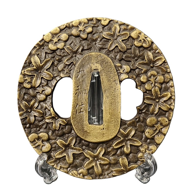 Tsuba with Cherry Blossom Design, Alloy, Craftsmanship: Tsuba with Sakura Motif, Alloy Material: Alloy, Thickness: Approximately 5mm, Weight: Approximately 125g. The item is solely the tsuba and does not include a tsuba stand. The item is handcrafted.