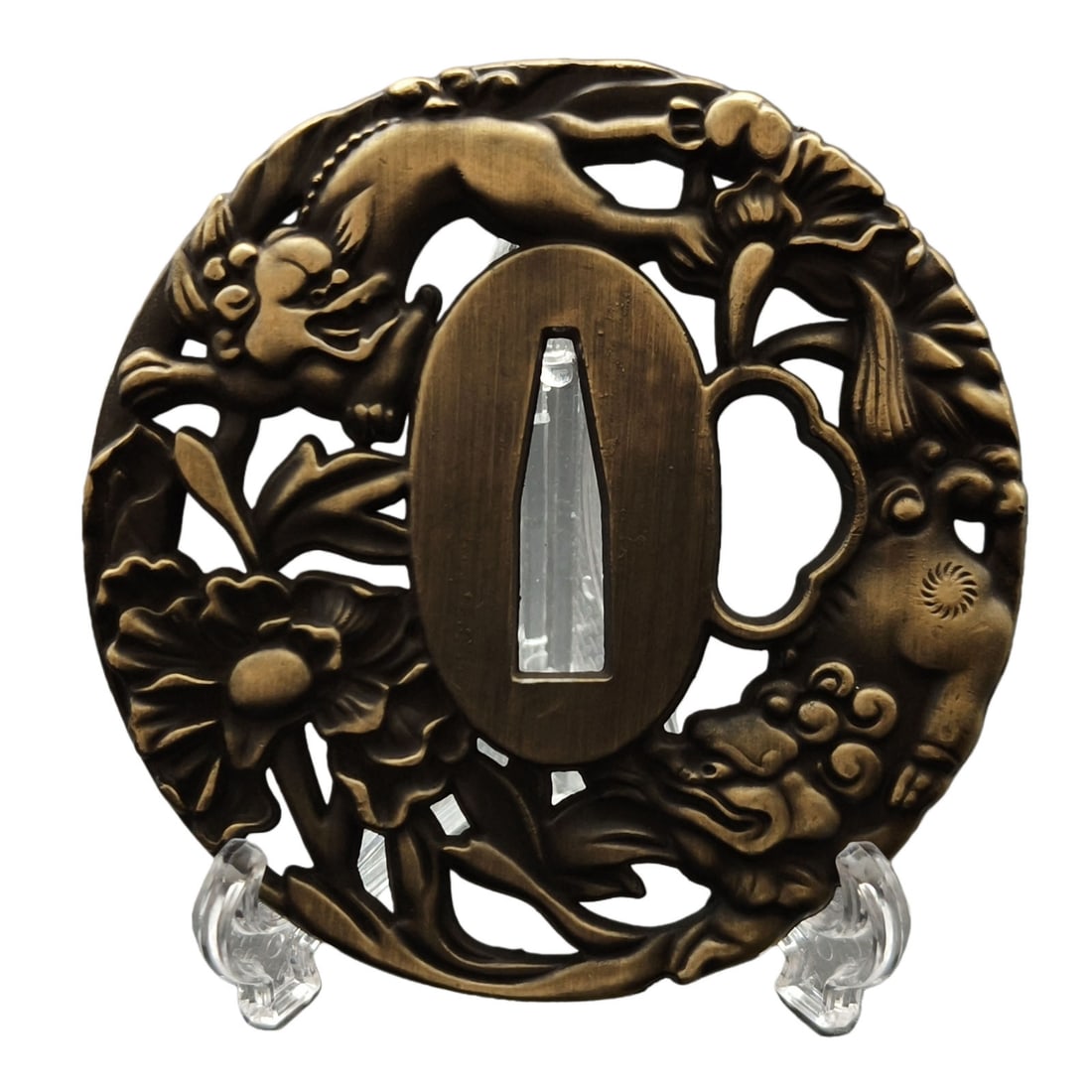 Tsuba with Peony and Lion Design, Alloy, Craftsmanship: Tsuba with Peony and Lion Design, Alloy Material: Alloy. Weight: Approximately 122 grams. Thickness: Approximately 7 millimeters. The item is solely the tsuba and does not include a tsuba stand. The i