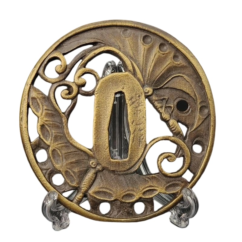 Tsuba with Double Butterfly Design, Alloy, Modern Piece. Tsuba, Sword Guard, Japanese Sword: Tsuba with Twin Butterflies Design, Alloy, Modern Piece Material: Alloy. Weight: Approximately 111 grams. Thickness: Approximately 5 millimeters. The item is only the tsuba; the sword stand is used fo