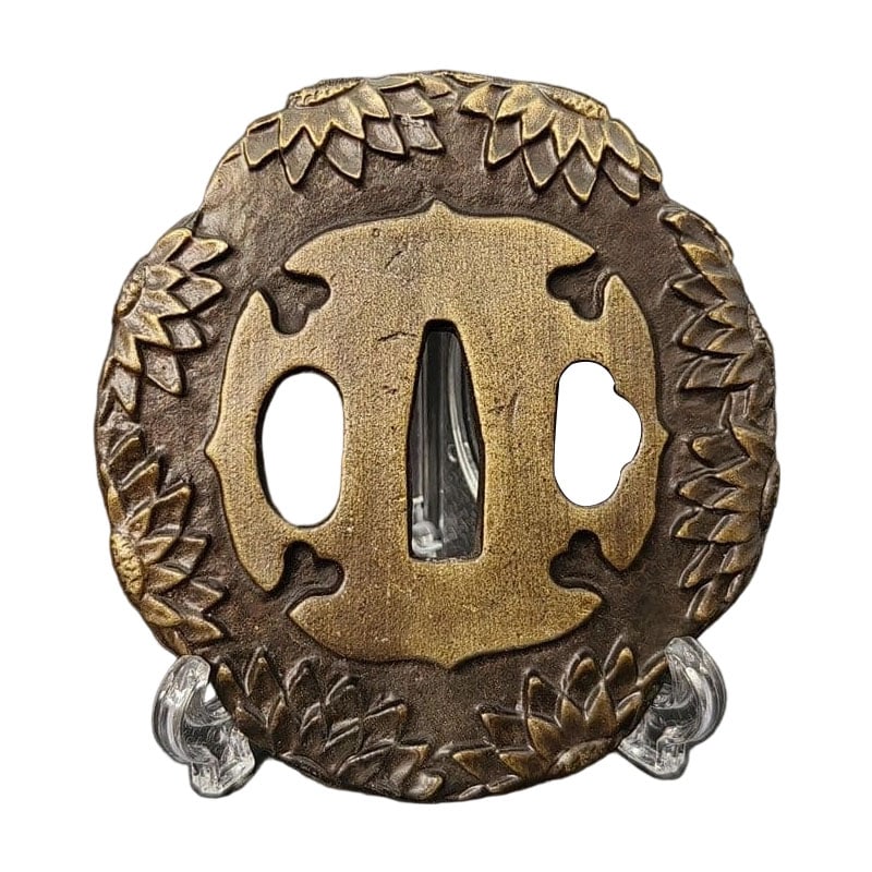 Tsuba with Chrysanthemum Design, Alloy, Modern Piece: Tsuba with Chrysanthemum Design, Alloy, Modern Piece Material: Alloy, Weight: Approximately 147 grams, Thickness: Approximately 7 millimeters. The item is only the tsuba; the sword stand is for photog