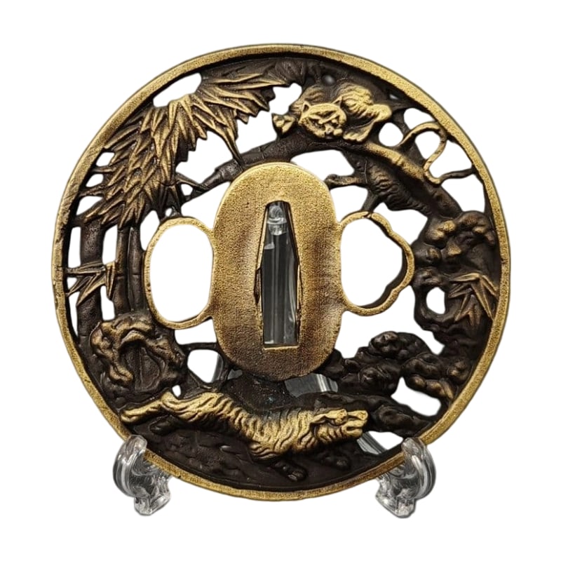 Tsuba with Twin Tiger Design, Alloy, Modern Piece: Tsuba with Twin Tiger Motif, Alloy, Modern Piece Material: Alloy Weight: Approximately 110 grams Thickness: Approximately 5 millimeters The item is only the tsuba; the sword stand is for photography p
