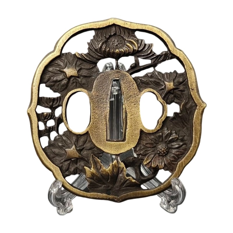 Tsuba with Chrysanthemum Design, Alloy, Modern Piece: Tsuba with Chrysanthemum Design, Alloy, Modern Piece Material: Alloy. Weight: Approximately 104 grams. Thickness: Approximately 6 millimeters. The item is only the tsuba; the sword stand is used for p