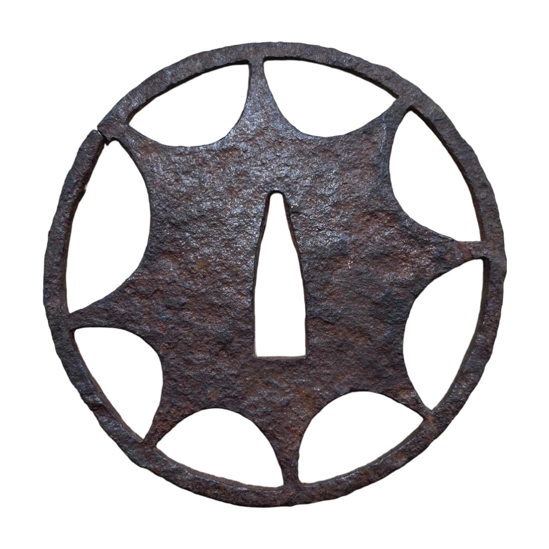 Tosogu Iron Tsuba Kuruma Sukashi Carved Edo Period Antique: Tosogu Iron Tsuba Kuruma Sukashi Edo Period Antique This is an iron tsuba, shaped in kuruma sukashi (Genji-guruma), with dimensions approximately 8.5 cm in length, 8.5 cm in width, and about 2 mm in