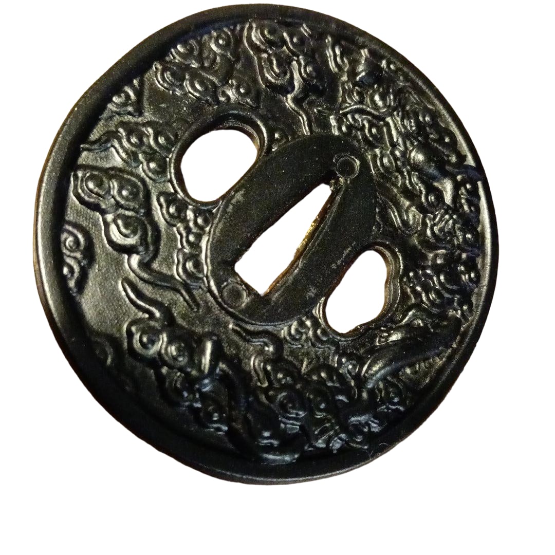 Black Metal Tsuba with Cloud Pattern, Japanese Sword Replica: Black Metal Tsuba with Cloud Pattern, Japanese Sword Replica A black metal tsuba featuring an intricate cloud pattern design. Dimensions: Length 7cm, Width 7cm, Weight 120g. The material is likely
