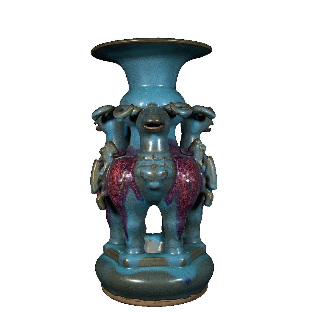 Song Dynasty Jun Kiln Jun Porcelain Three Ram Vase: This piece is a work from the Song Dynasty Jun kiln. It features a distinctive form with a three-ram motif symbolizing good fortune, a warm and lustrous glaze, and a natural patina, all of which showc