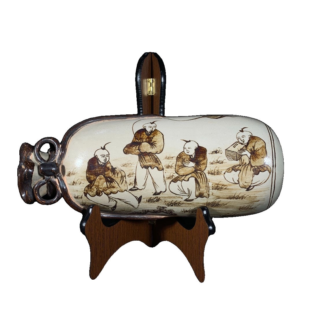 Song Dynasty Cizhou Kiln Hand-painted Boy Pattern Pillow: This ceramic pillow originates from the renowned Song Dynasty Cizhou Kiln, famous for its hand-painted boy patterns. The bag-shaped design is not only practical but also artistically valuable,