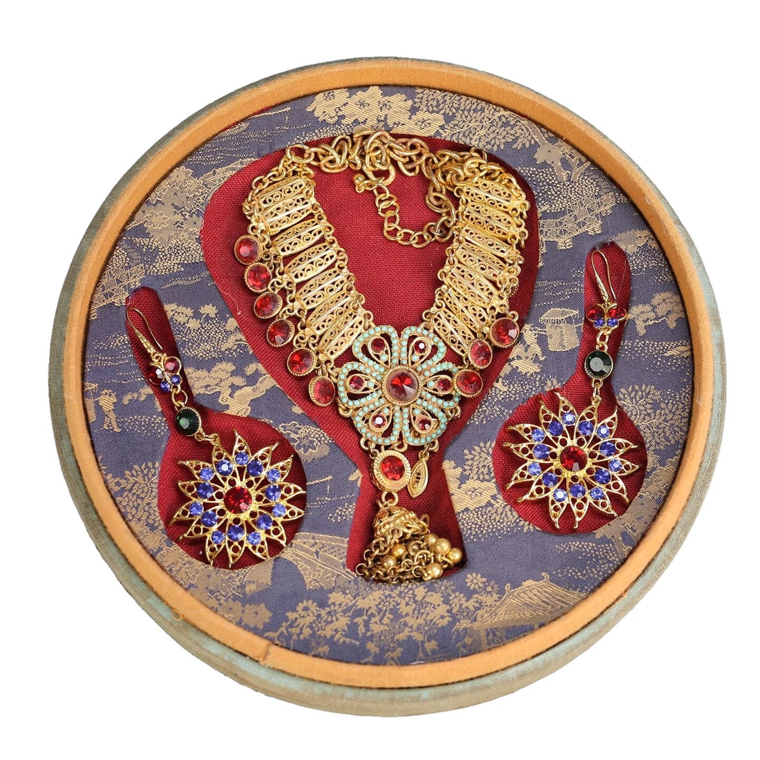Gilt Copper Inlaid Jewelry Set: This gilt copper inlaid jewelry set is exquisitely crafted with a unique design, showcasing a perfect blend of tradition and modernity. The necklace and earrings complement each other, suitable for va