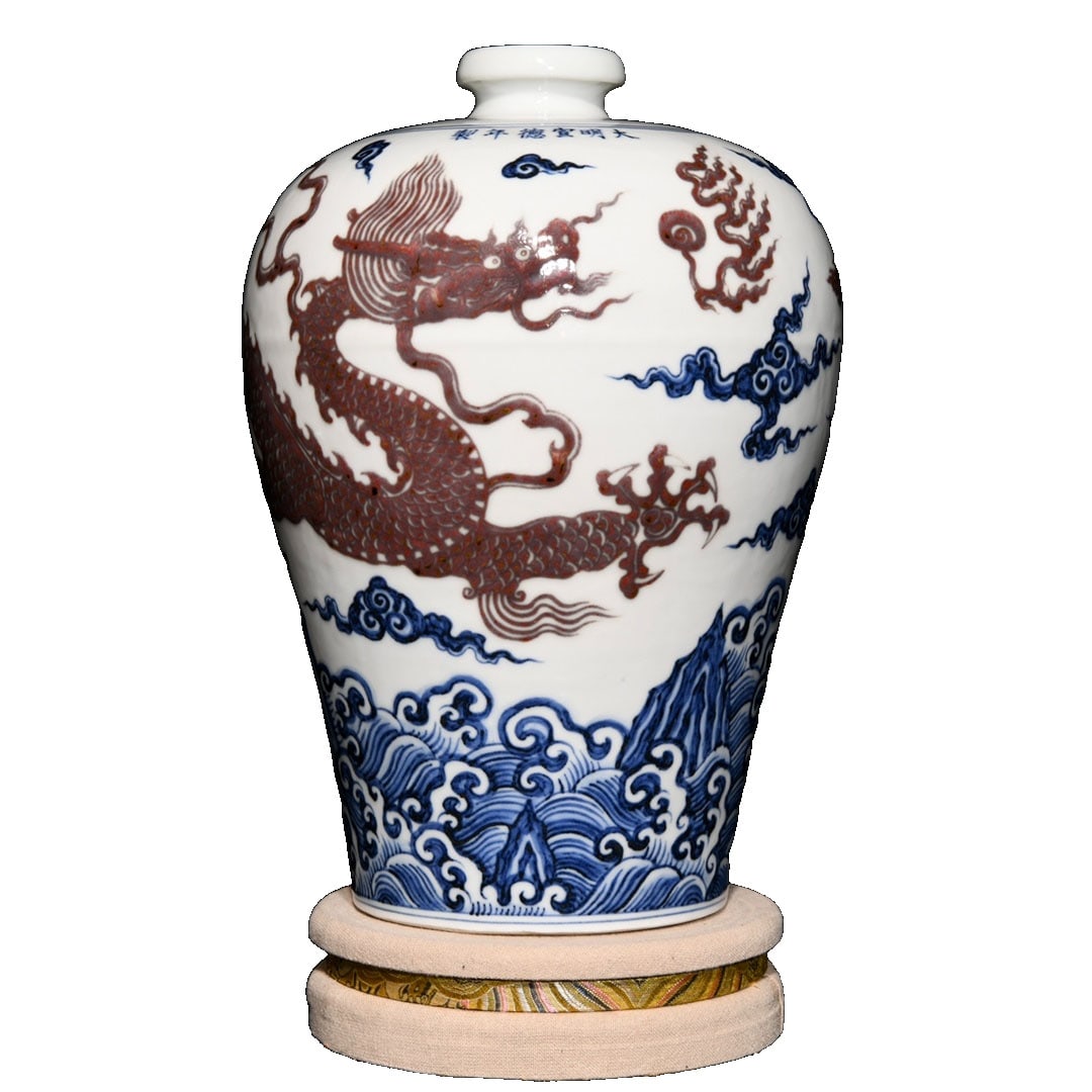 Ming Xuande Blue and Red Dragon Pattern Meiping: This meiping is a blue and red underglaze work from the Ming Xuande period, featuring vivid dragon patterns and vibrant glaze colors, showcasing high artistic value and historical significance. The
