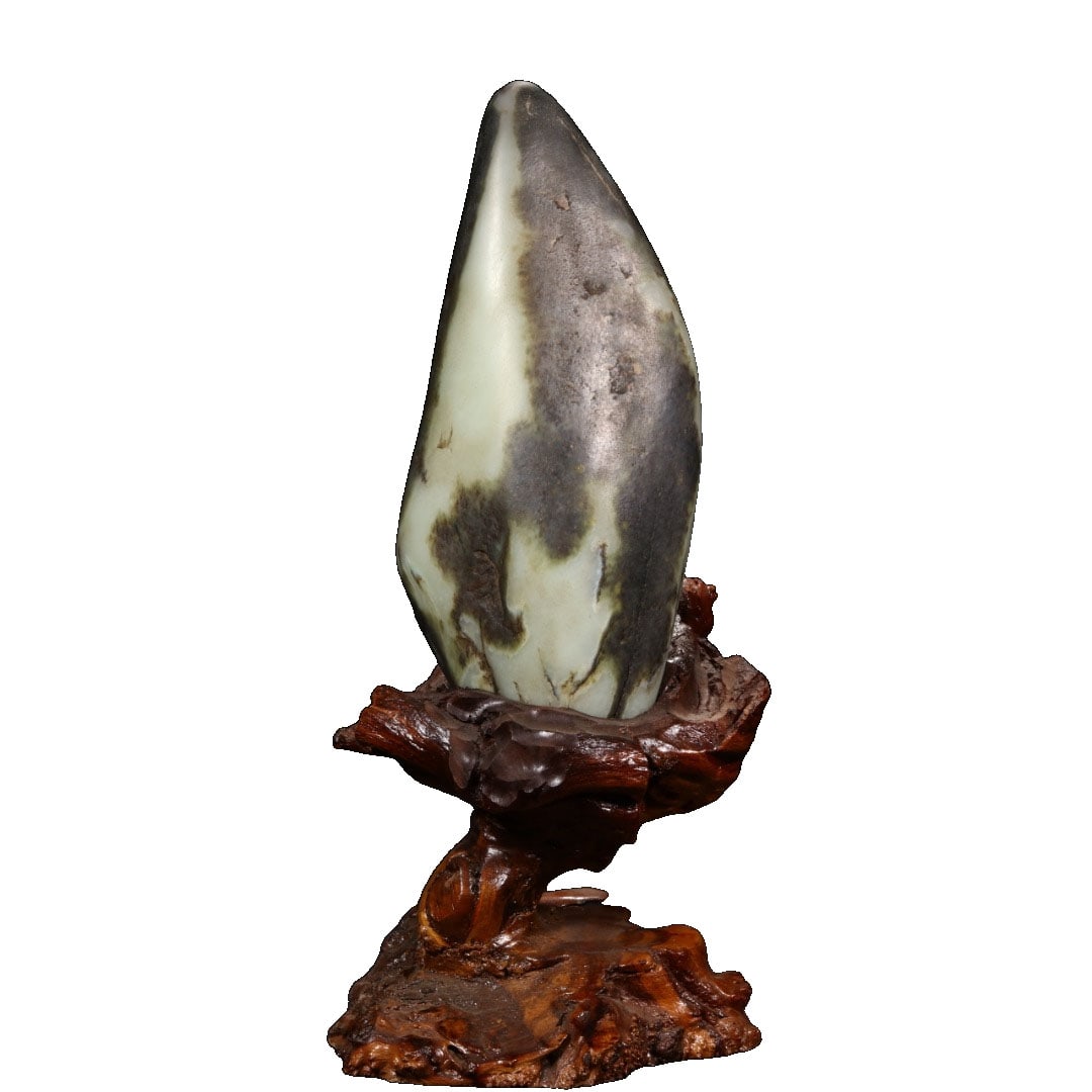 Hetian Jade Black Skin Rough Stone: This Hetian jade black skin rough stone features a fine texture and deep color, showcasing its natural beauty. The black skin is evenly distributed, adding to its unique charm. It is suitable for