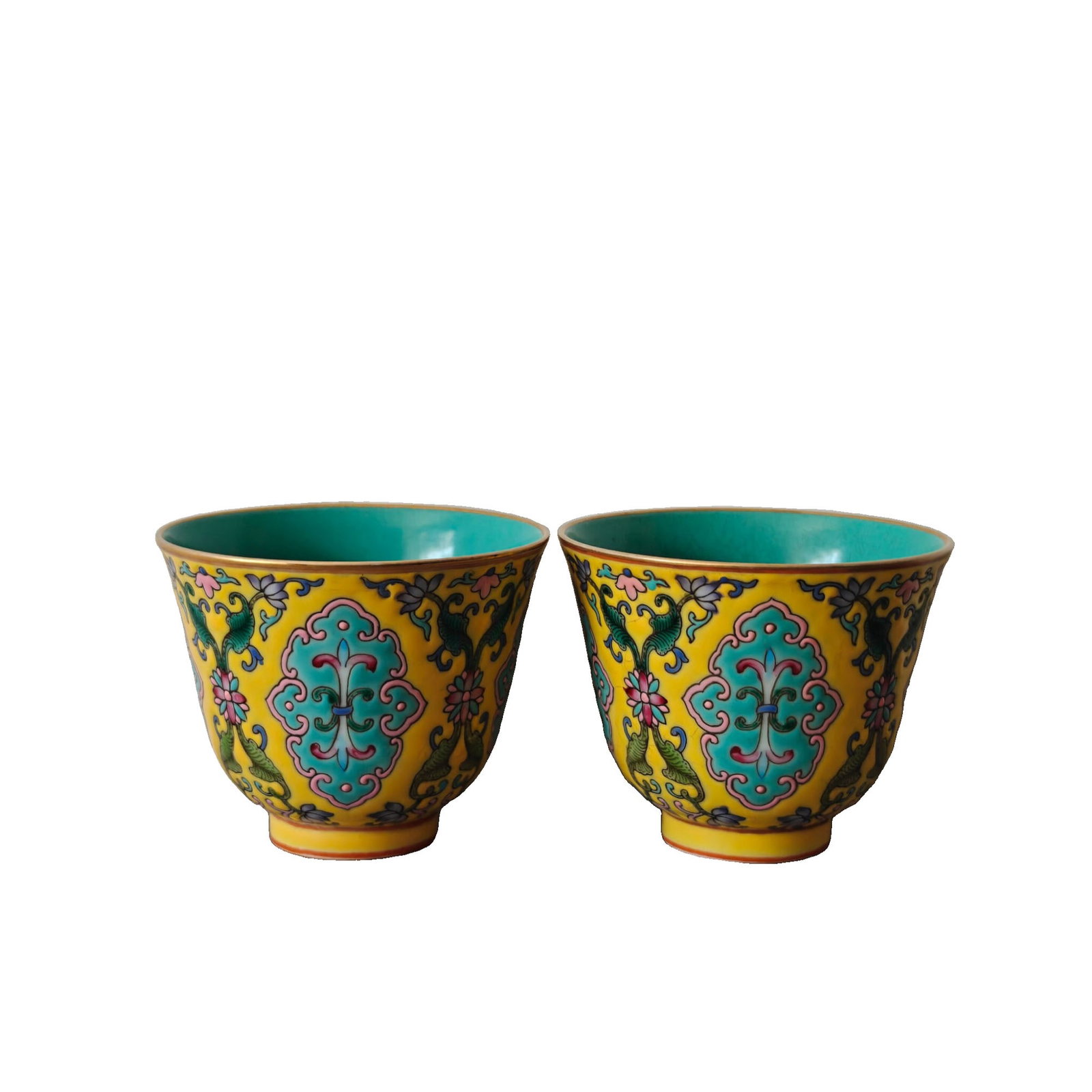 Qing Dynasty Yongzheng Enamel Cup: This pair of enamel cups showcases the exquisite craftsmanship of the Yongzheng period of the Qing Dynasty, with vibrant colors and delicate patterns, possessing high artistic and collectible value.