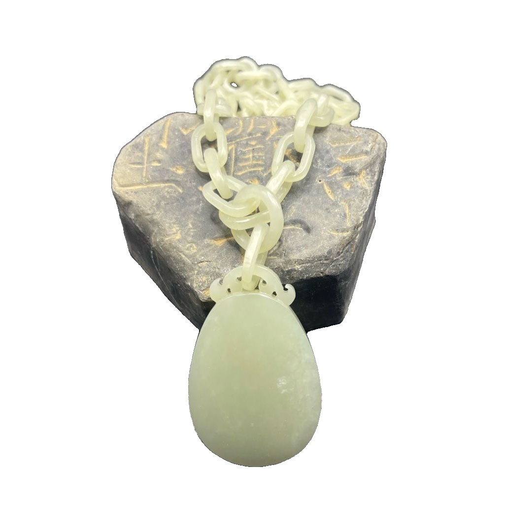 Hand-carved Antique Nephrite with Certificate of Authenticity: Hand-Carved Antique Nephrite with Certificate This is a hand-carved antique nephrite piece. The pendant and connecting parts are carved integrally from the same piece of jade material. It measures 53 