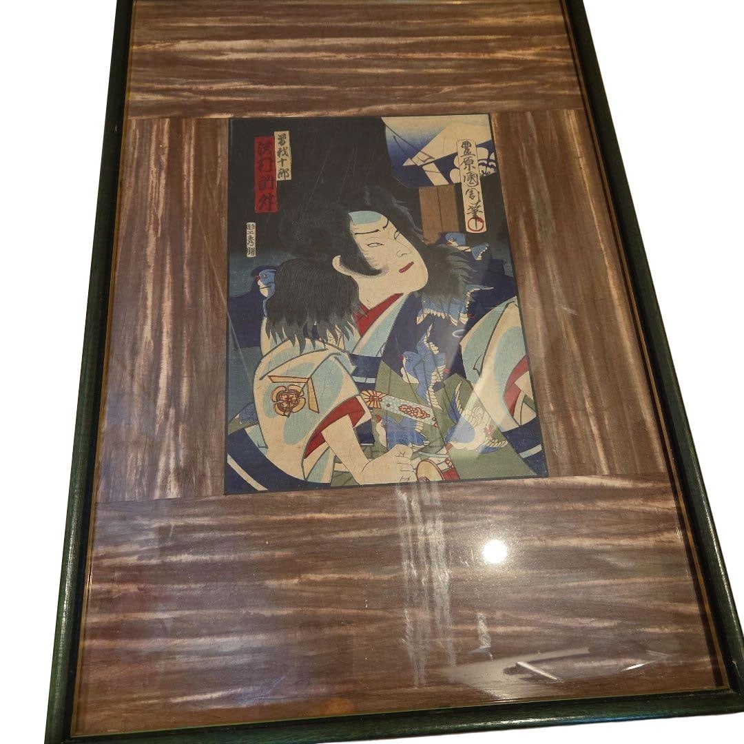 Framed Ukiyo-e "Kabuki" Artwork: This is an ukiyo-e depicting a scene from a Kabuki play, mounted in a wooden frame. Subject: Kabuki Specification: Framed work Frame Material: Wood