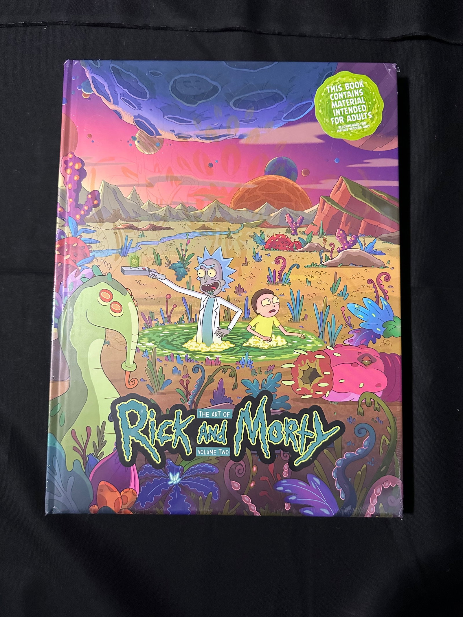 The Art of Rick and Morty Volume 2 Copy B: This full-color hardcover artbook showcases the third and fourth seasons of the animated science-fiction adventures of everyone's favorite alcoholic scientist and his grandson! Rick and Morty are back