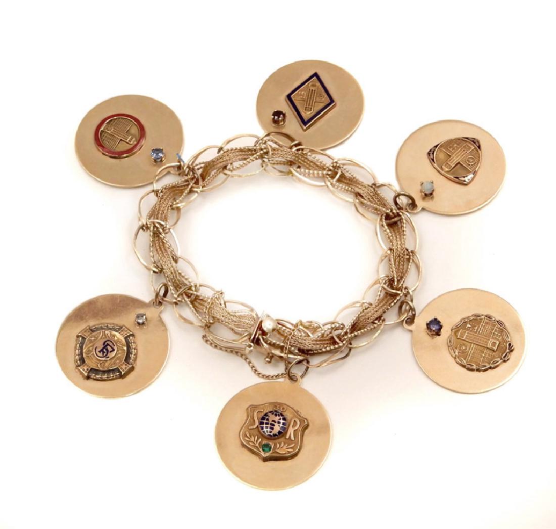 14k yellow gold charm bracelet with six Sears &: 14k yellow gold charm bracelet with six 14k yellow gold charms, openwork bracelet having box clasp with fold-over safety guard and chain, 6 Â¾â€ circumference, 3/8â€ wide, each 1â€ diameter
