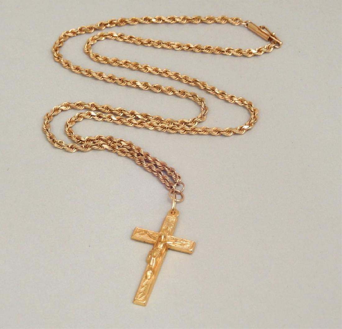 Gold cross and chain: Gold cross and chain, 18k gold crucifix on 10k gold chain, cross measures 1 1/4" in length, stamped 18k GM, attached with ring to 19" 10k gold rope chain, stamped 417 (for 10k), 6.5 dwt