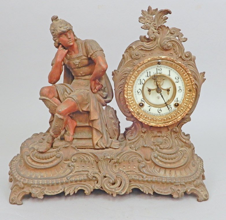Ansonia figural mantle clock: Ansonia figural mantle clock, seated Roman figure, porcelain dial, with pendulum and key, marked on dial and on works, 14 1/2" x 16 1/4" x 7 1/2"