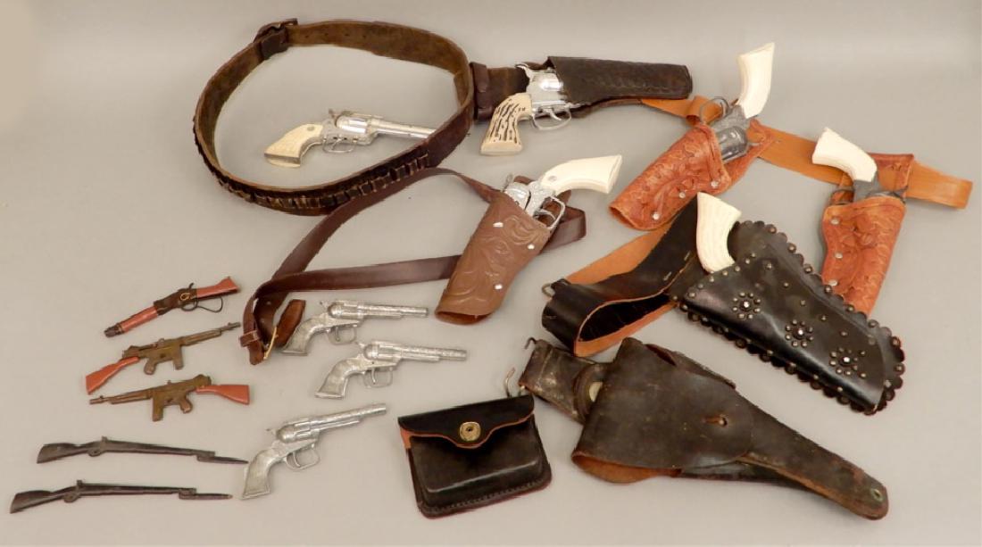 Grouping of toy cap guns: Grouping of toy cap guns, includes Mattel Fanner 50 in leather holster, pair of Pony Boy guns in holster, one marked Made In China in holster, Pony Boy gun in leather holster, Nichols Stallion 250, th