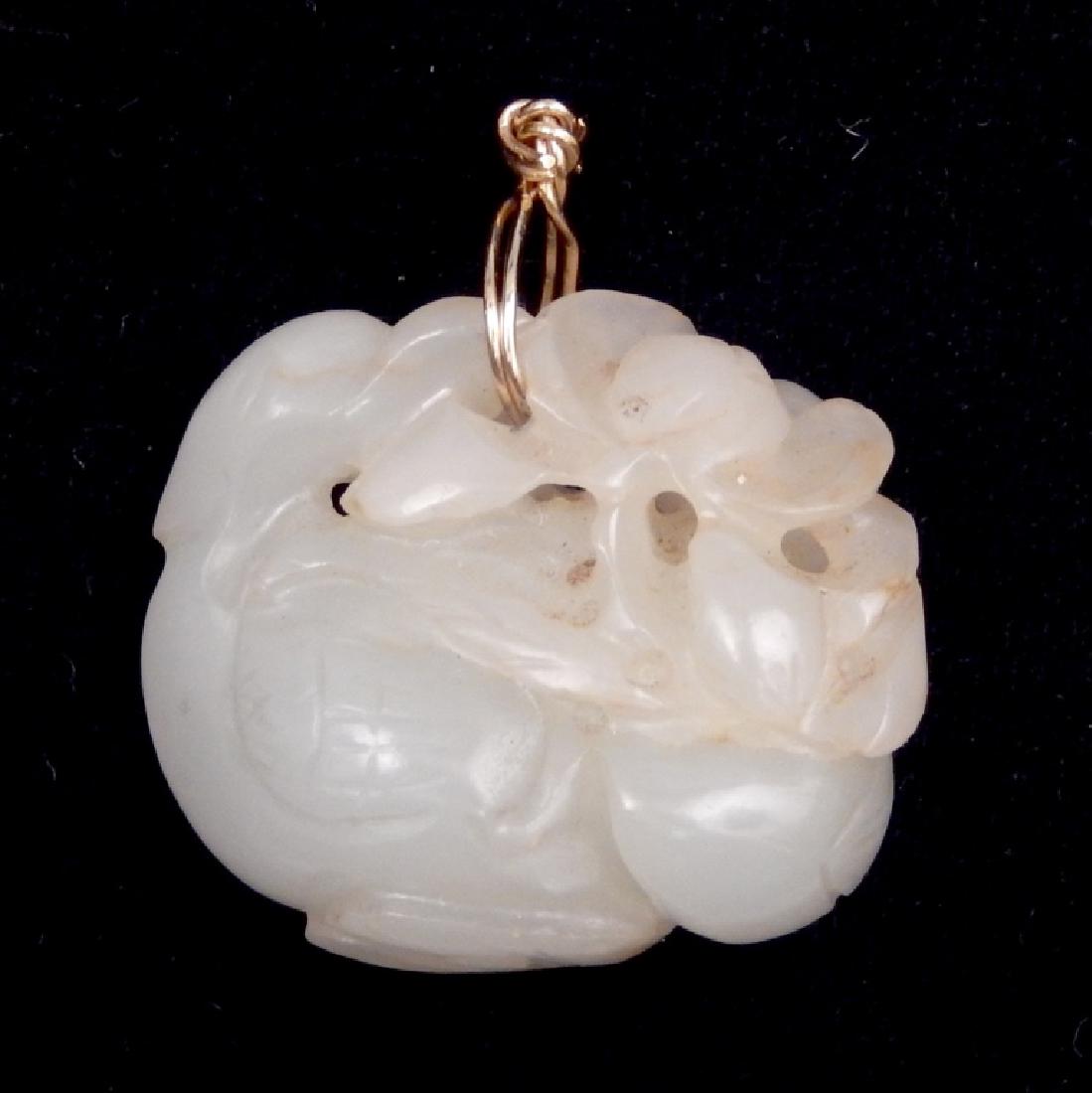 Carved Chinese jade swan pendant: Carved Chinese jade swan pendant, carved mutton fat jade swan with lotus blossoms, 1 3/8" long x 1 3/8" wide, gold wire bale, unmarked, tests 14k, weight 30.1 grams/19.3 dwt