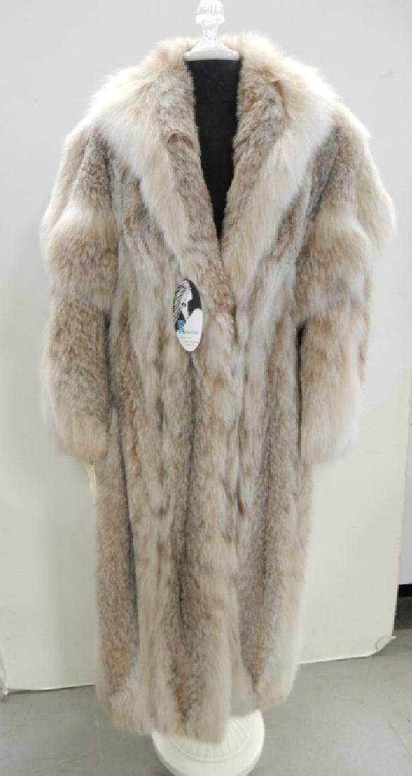 Full length Canadian lynx fur coat: Full length Canadian lynx fur coat, size medium/large, champagne color satin lining, Diane Furs label, 49" long from collar to hem, 63" sweep, 25" from shoulder to sleeve, 20" across bust, hook and ey