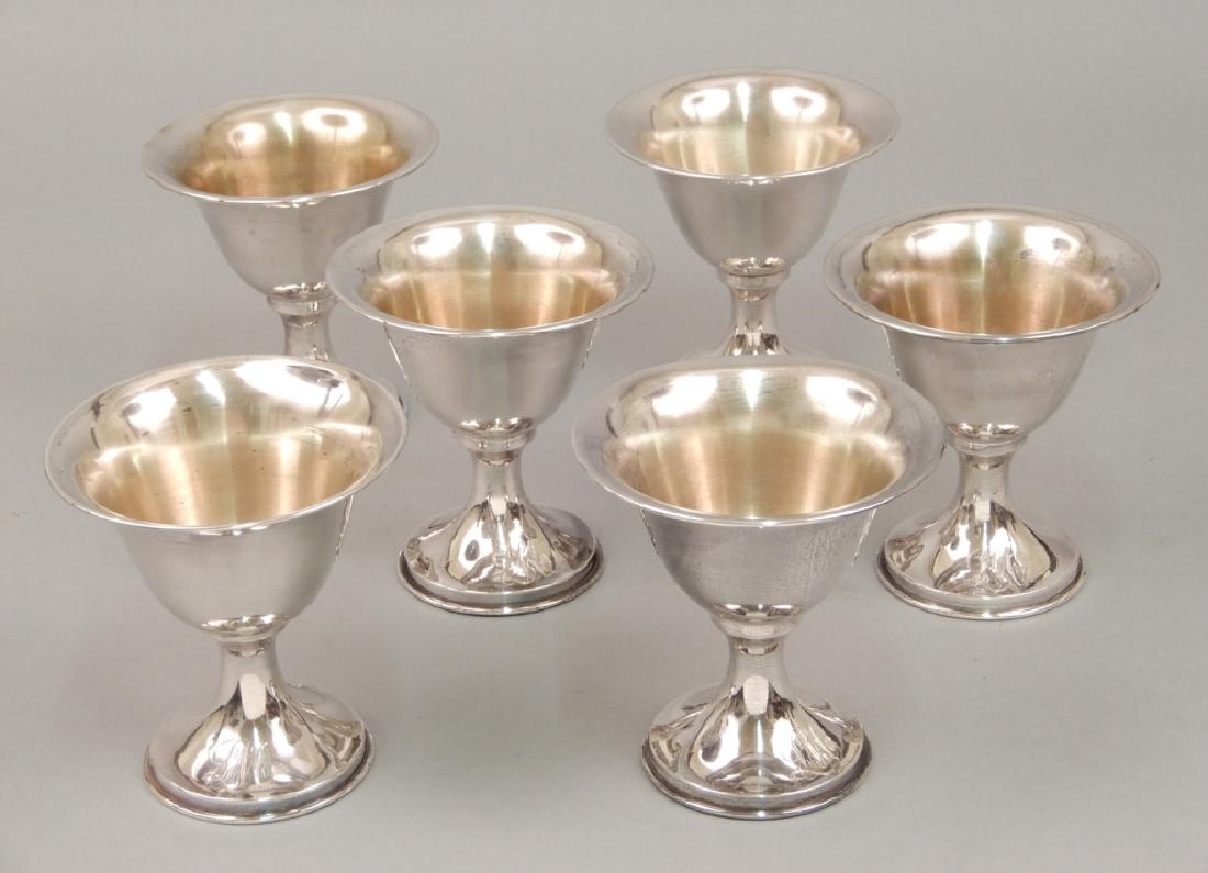 Six sterling silver wine cups: Six sterling silver wine cups, monogrammed LM, marked sterling, partial gilt interior, measures 4 1/4" high, weighs 15.72 ozt