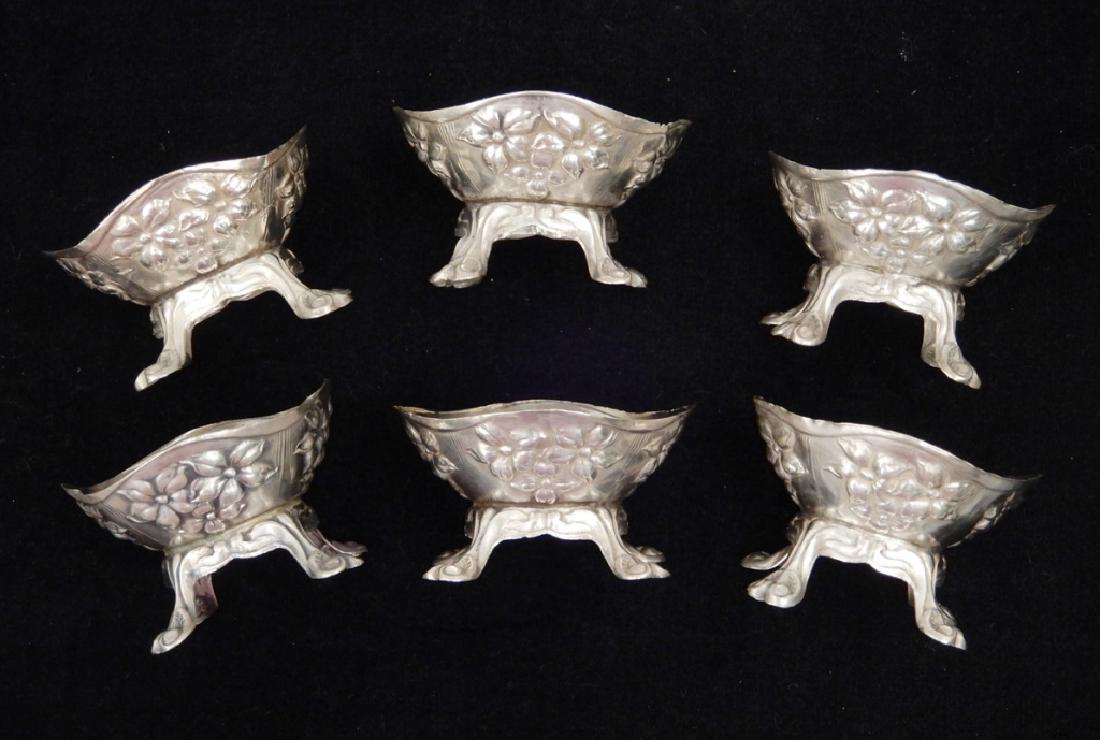 Set of six sterling salts: Set of six sterling salts, floral repousse design, scroll feet, marked sterling, 1 1/8" x 1 3/4", weighs 1.83 ozt.