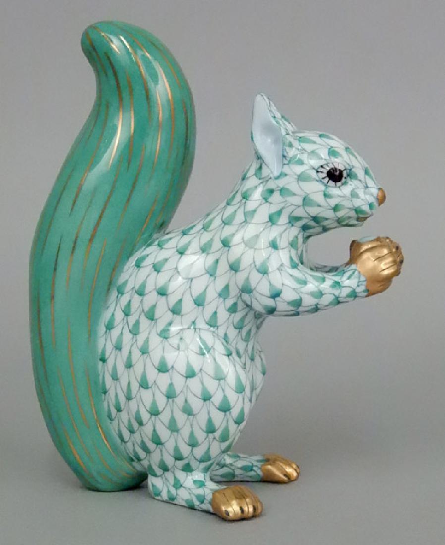 Herend porcelain Squirrel figurine in green fishnet: Herend porcelain Squirrel figurine in green fishnet pattern, hallmarked and numbered on bottom 15388, 4 3/4" high x 3 3/4" across