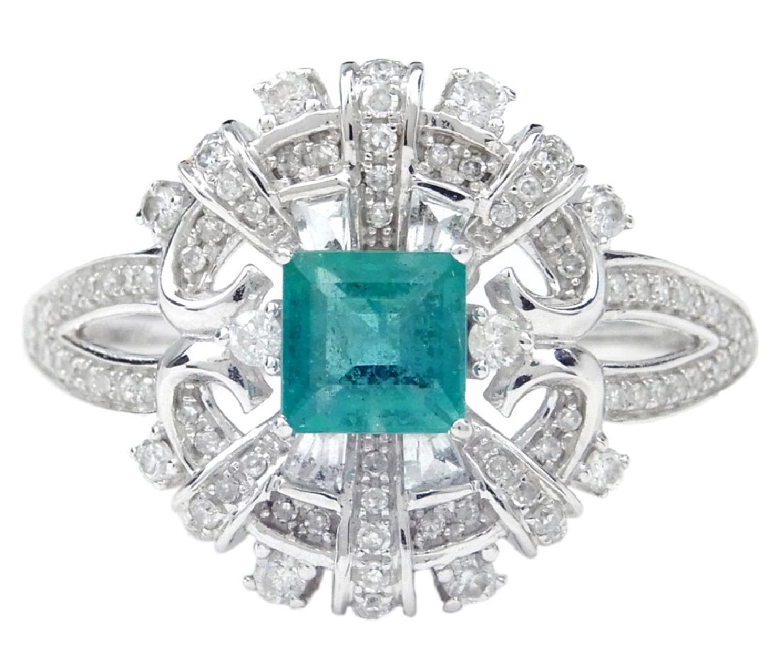 14k white gold emerald and diamond ring: 14k white gold emerald and diamond ring, square emerald in center measuring 5mm x 5mm, surrounded by small round diamonds and four synthetic baguette shaped stones in antique style mounting, 5/8" long