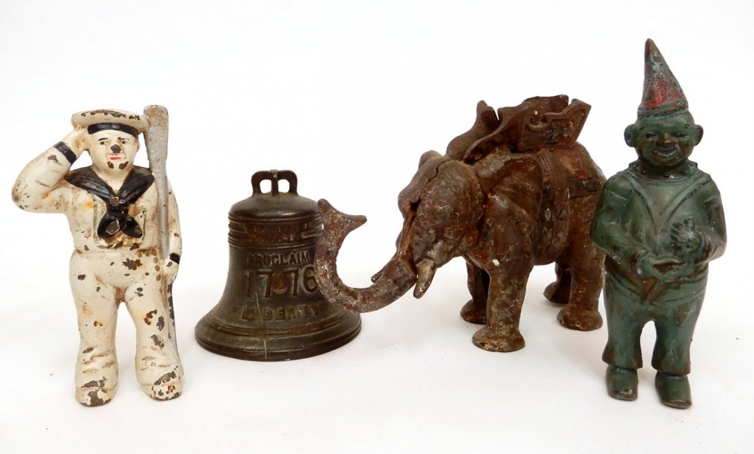 Four cast iron still and mechanical banks (1 of 9)