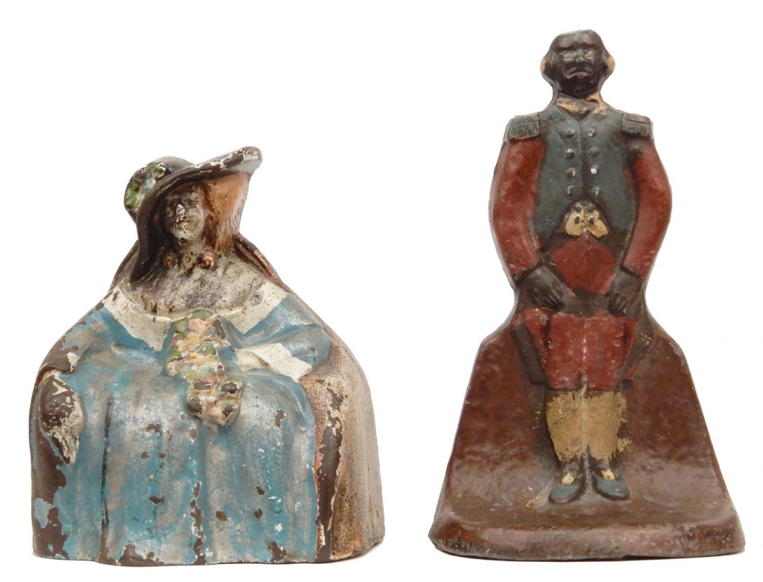 Two cast iron doorstops: Two cast iron doorstops, Major Domo, design #1249 by Judd Co., 8 1/2", and Victorian Lady Sitting in Chair, design #149 by Albany Foundry, 7"