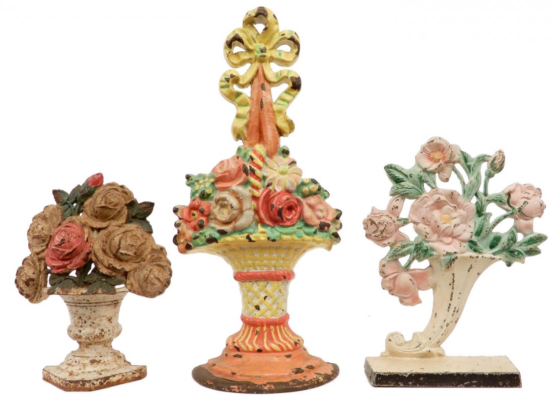 Three cast iron doorstops: Three cast iron doorstops, Hubley Rose Vase, impressed 441 on back, 10 1/4", Hubley Roses impressed 443 on back, 8 3/4", and Flower Basket, 16"