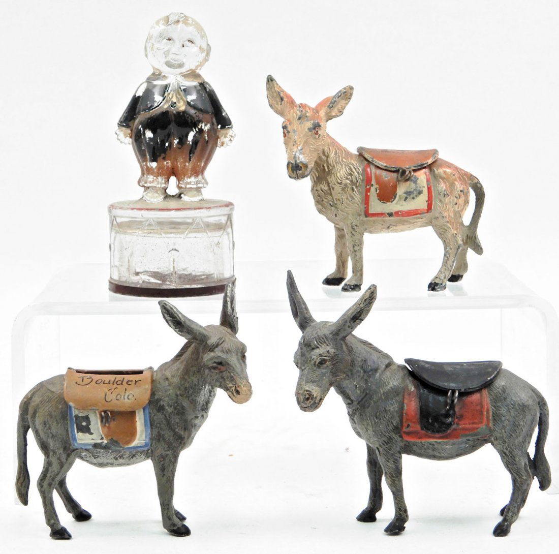 Three donkey souvenir spelter still banks and a glass (1 of 3)