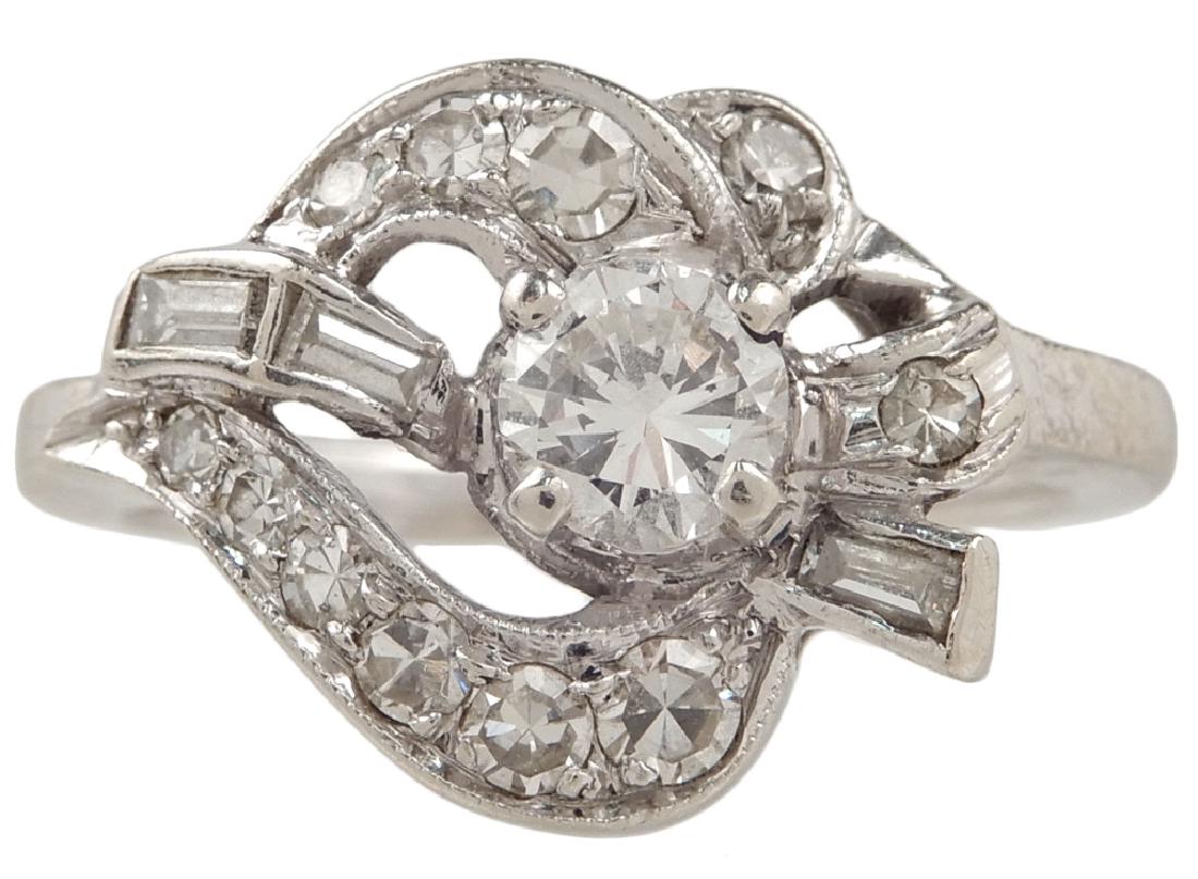 Retro 14k white gold and diamond ring: Retro 14k white gold and diamond ring, round center stone measuring approximately 0.25 carats, surrounded by three baguettes and eleven round diamonds measuring from 0.01-0.05 carats each, size 4 1/2,