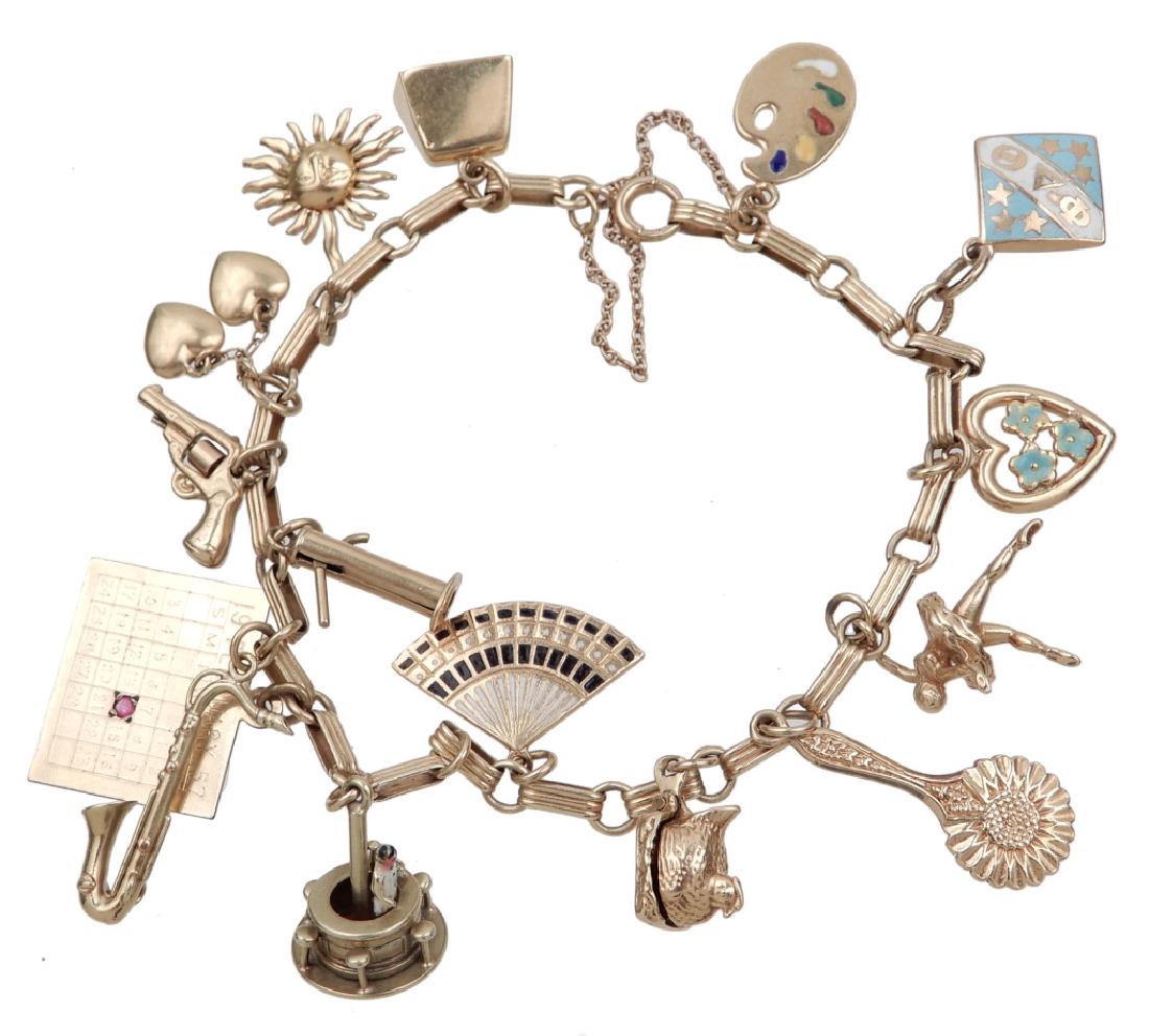14k gold charm bracelet with fifteen charms (1 of 6)
