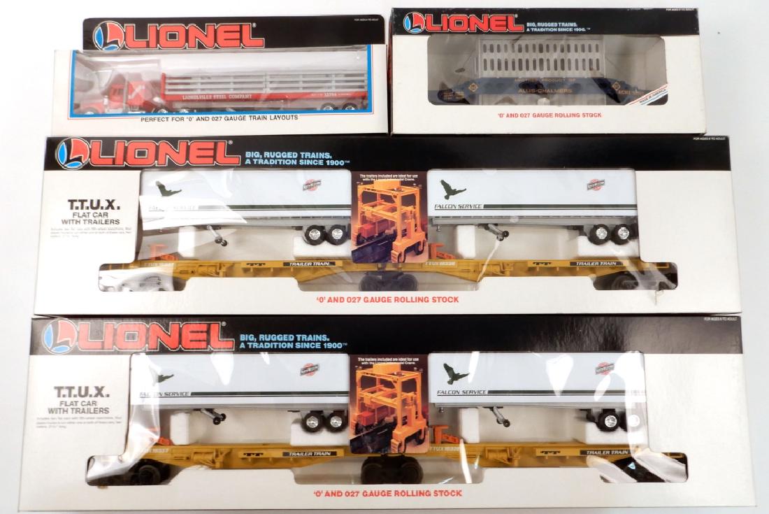 Four Lionel freight cars and tractor in boxes (1 of 4)