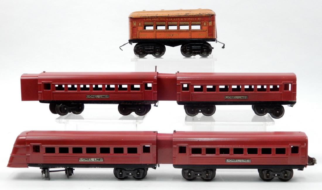 Lionel Lines prewar passenger cars and an American: Lionel Lines prewar passenger cars and an American Flyer passenger car, includes four articulated Lionel Lines Jr. red passenger cars, and American Flyer Chicago, Milwaukee & St. Paul RY 1206 Seattle