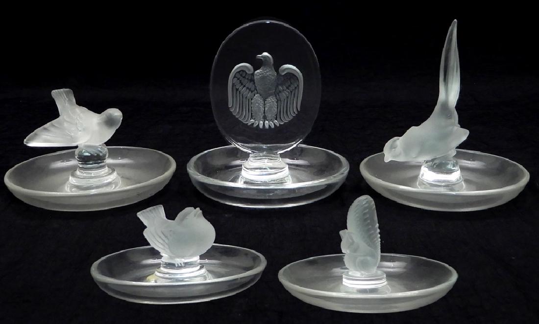 Five Lalique crystal pin trays: Five Lalique crystal pin trays, clear and frosted crystal, all with script signature Lalique France on bottoms, includes Aigle, paper label Made in France on bottom, 4" x 3 3/4", Ecureuil, 2 1/2" x 4"