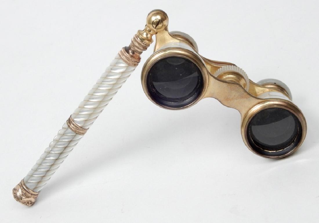 Audemair Paris mother of pearl opera glasses: Audemair Paris mother of pearl opera glasses, swivel handle, 6" length of handle, 1 7/8" x 4 3/4"