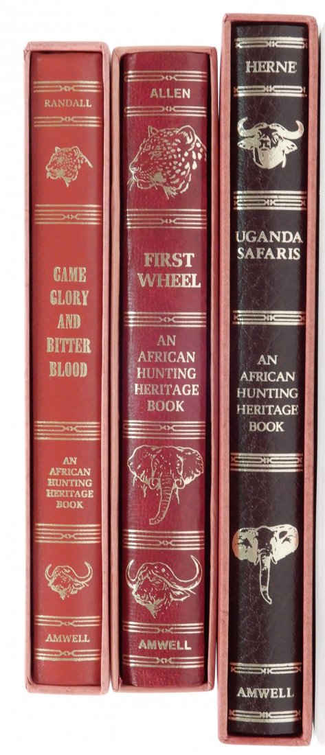 Three gilt leather bound books: Three gilt leather bound books, Amwell Press, illustrated, all with slipcases, includes 1.) Uganda Safaris, Limited Edition #742 of 1000, signed Brian Herne & James Rikhoff, 2.) First Wheel, Limited E
