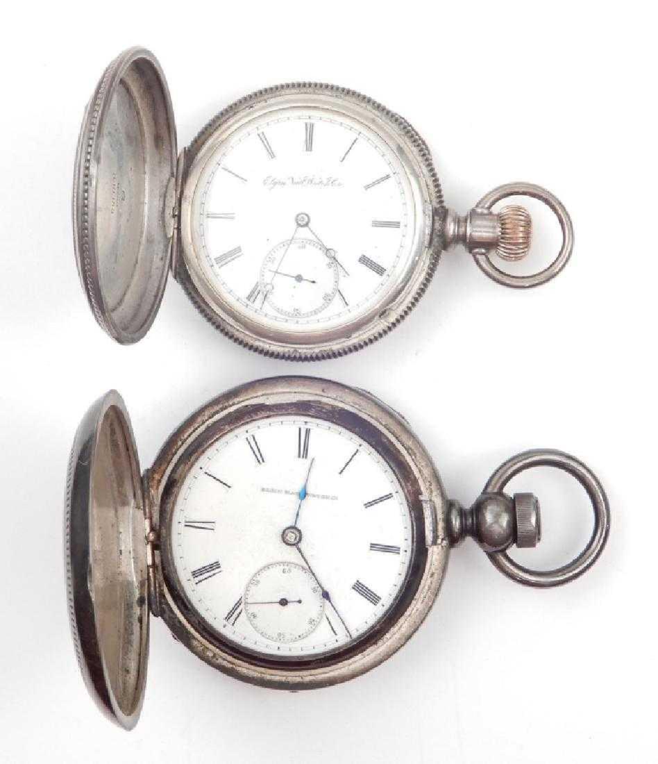 Two Elgin coin silver pocket watches: Two Elgin coin silver pocket watches, one key wind with engraved hunting case, 2 1/4" diameter, inside of case stamped Keystone Coin 120261, face marked "Elgin National Watch Co."; second watch with e