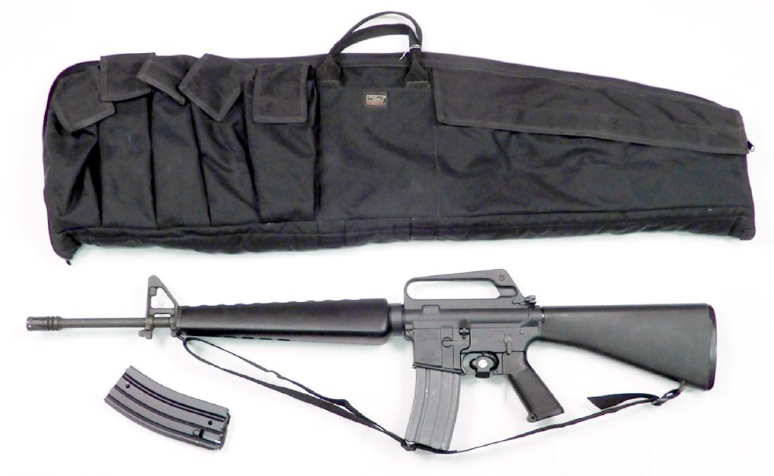 Colt semi-automatic AR-15 Mod SP1.223 cal rifle pre ban: Colt semi-automatic AR-15 Mod SP1 .223 caliber rifle pre ban, two magazine feed, serial number 114885, with nylon sling and Uncle Mike's sidekick soft side carry case, barrel length 19 1/2", overall l
