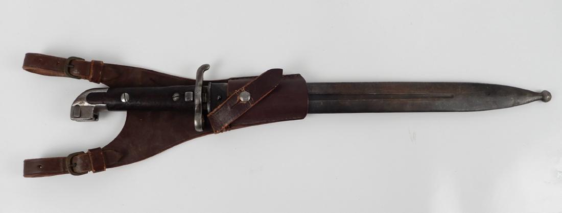 Swedish M1914 bayonet in scabbard: Swedish M1914 bayonet in scabbard for 1894 Mauser, guard numbered 561 on one side, other side numbered 1/k 7 No. 101, with leather frog, blade length 13 1/8", overall length 19"