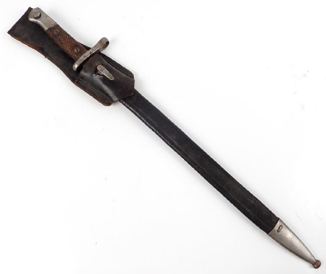 Toledo Spanish M1893 Mauser bayonet in scabbard: Toledo Spanish M1893 Mauser bayonet in scabbard, marked on ricasso 87707 B, Artilleria Co. Nacional Toledo, marked 0 on guard, leather scabbard with frog, blade length 15 1/2", overall length 21 3/4",