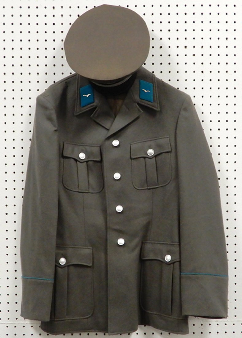 East German Officers jacket and visor cap: German Officer's jacket and visor cap, jacket tag Sturm Made in Germany, SG 48-0, and visor cap, marked NVA 58, 1856 P, Rehier written inside cap