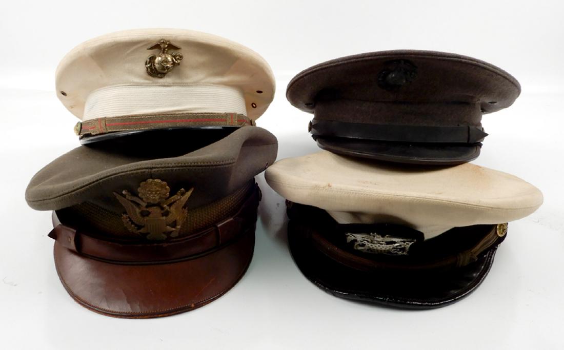 Four U.S. military visor caps: Four U.S. military visor caps, includes Army, white cap Naval Reserve cap, named for Lt. Roger Howe Gilman, made by Hilborn-Hamburger, New York, and two USMC visor caps, white cap with label Kay-Bee B